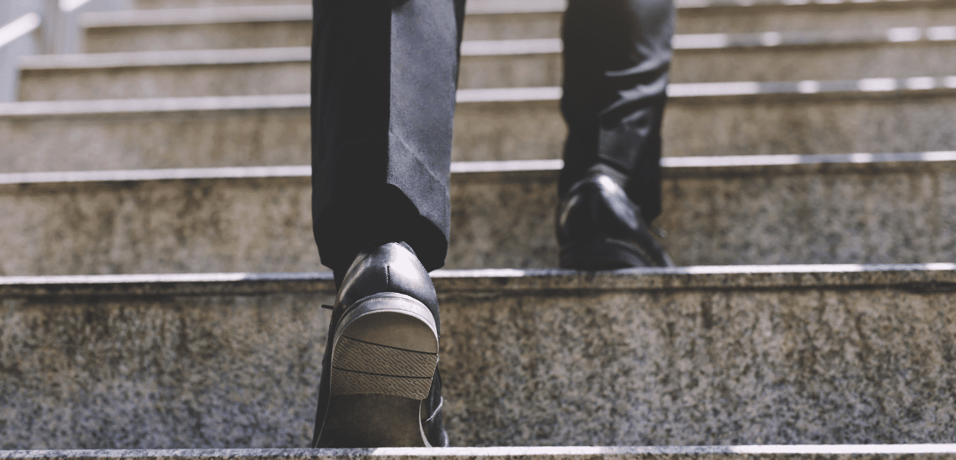 man walking up stairs